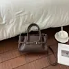 Bolso de mujer con patrón de lichi vintage para otoño e invierno 2026 nuevo bolso de mano de nicho de moda bolso tote bolso cruzado versátil