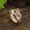 Anillo elástico geométrico hueco de nuevo color esmaltado transfronterizo, pétalo, anillo de flor simple de alta gama versátil para mujer