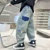 Ropa Infantil para Niños Jeans de Otoño Nuevos Elegantes Pantalones Largos Pantalones Holgados Atractivos de Primavera y Otoño Venta al por Mayor Transfronteriza Modernos