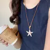 2026 Modelo Caliente Nuevo Océano Playa Concha Estrella de Mar Borla Perla Fresco Moda Tendencia Corazón Collar para Mujeres