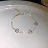 Pulsera hueca de flor de circonita con incrustaciones de diamantes, simple, de lujo ligero, con sentido de alta gama, pulsera de nicho, moda versátil, joyería al por mayor para mujeres