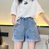 Jeans de Niña Verano Sección Delgada 2025 Nueva Moda Estilo Coreano Corazón Mezclilla Sueltos Casuales Shorts Tendencia