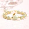 Pulsera de conejo blanco y verde imitación jade Hetian natural pulsera de conejo para mujer verano lujo ligero ins minoritario jade cuerda de mano