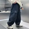 Pantalones Gruesos Forrados de Polar para Niños Otoño e Invierno 2025 Nuevo Estilo Polar Integrado Pantalones Cargo de Invierno para Estudiantes de Secundaria Niños Moda