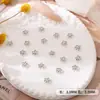 Accesorios Metálicos para Uñas Aleación Flor de Cinco Pétalos Arte de Uñas Fábrica Venta al por Mayor Mini Flor de Perla Uso para Uñas Decoración de Uñas