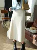 Falda midi elegante de acetato y lana estilo francés Yunshuyaxu, de cintura alta, línea A, que cubre la cadera, adelgazante y fluida para el trabajo