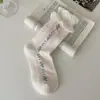 Boca de burbuja capullo de flor lazo flor pequeña calcetines mujer primavera otoño sin costuras calcetines de media pantorrilla ins de moda estilo japonés calcetines holgados moda