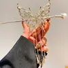 Carrillón de Viento de Mariposa Borla Pasador de Pelo de Perla para Mujer 2026 Nuevo Popular Pasador Exquisito de Gama Alta Nicho Accesorio para el Cabello