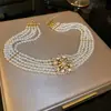 Collar de perlas en capas con cuentas transfronterizo europeo y americano, cadena para la clavícula estilo fiesta vintage, lujo ligero, accesorio versátil de alta gama para mujer