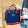 Nueva bolsa de tutoría para estudiantes con bloques de color estilo británico, bolsa cruzada impermeable de tela Oxford de gran capacidad para tutoría, bolsa de arte portátil