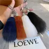 Llavero de coche de piel de zorro, colgante para bolso de piel auténtica, adorno colgante de peluche, decoración de cola linda, accesorio de llavero personalizado y elegante