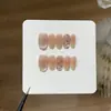 Uñas Postizas con un Suave Gradiente Rosa Nude Transparente como el Hielo con Puntos de Brillo Verde y Diseño Cat-Eye de Gota de Agua
