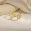 Pendientes geométricos huecos de estrella europeos y americanos, nicho retro, diseño versátil de moda transfronteriza, ear cuffs de círculo geométrico para mujer