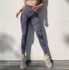 Pantalones deportivos de cintura alta con estampado de leopardo color melocotón para realzar la cadera, populares en línea para mujeres europeas y americanas, pantalones de yoga de secado rápido.
