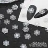 Novos Ornamentos de Unha de Floco de Neve de Natal Atacado Gelo Através de Floco de Neve Tridimensional Peça Brilhante Fina Branca Decoração de Unha de Resina