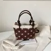 Bolso tipo cubo casual estilo coreano, nuevo bolso de mano otoño e invierno 2026, bolso de hombro y cruzado de moda con lunares único