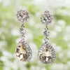 Venta directa de fábrica, nuevos y populares, aretes de aleación de zinc color diamante, aretes largos de cristal para mujer, en stock, venta al por mayor