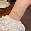 Pulsera extensible de concha de estrella y luna de estilo nicho, piedra ojo de gato, accesorio de mano de estilo vintage, joyería de lujo ligero de alta gama para mujer