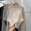 Suéter de punto casual de alta gama para mujer, nuevo diseño de otoño e invierno, cuello redondo, manga larga, dobladillo suave tipo cera con abertura, suéter de punto con temperamento