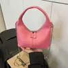 Bolsa de Dumpling Portátil de Nicho Transfronteiriça para Mulheres 2025 Nova Versátil Bolsa de Axila Simples e Estilosa Bolsa Transversal com Alça de Corrente