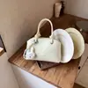 Bolsa de Concha para Mulheres 2026 Novo Modelo Bolsa de Mão Ombro Transversal Versátil para o Dia a Dia Design de Nicho Bolsa com Toque de Luxo
