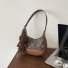 Bolsa de Ombro Nova de Luxo Leve Outono 2026 Bolsa de Ombro Transversal da Moda Grande Capacidade Bolsa de Mão Feminina de PU para o Dia a Dia