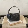 Bolso de hombro y bandolera versátil, simple y elegante, de nicho, para mujer, verano 2026, nuevo diseño tejido de albóndiga