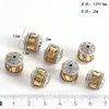 Xizang antiguo oro y plata costura nubes auspiciosas patrón trasero cuentas barril cuentas de cintura cuentas espaciadoras cuentas de tambor rueda giratoria dorada trasera Accesorios de aleación de nube en la espalda