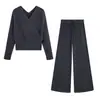 Atacado de roupas femininas estilo europeu e americano Ins, nicho, conjunto de tricô com gola cruzada e calça de tricô de cintura alta com amarração na cintura