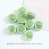 Color plateado claro con cuentas material para joyería DIY cuentas cerámicas sueltas obladas agujero recto accesorios para cadena de teléfono móvil venta al por mayor de cuentas cerámicas
