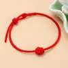 Sencilla nueva cuerda de mano tejida a mano para mujer nudo de diamante geométrico Festival del Bote Dragón cuerda roja pulsera de cuerda colorida al por mayor