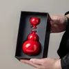 Juego de vino de cerámica de alta calidad y estéticamente agradable que incluye decantador de vino, copas de vino y vertedor de vino, un regalo creativo y lujoso para celebrar la buena fortuna y la prosperidad