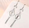 Pendientes con borlas de plata de ley 925 para mujer, temperamento coreano, súper inmortales, elegantes, finos, con diseño de nicho y sentido del humor.
