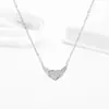 Collar con Anillo de Corazón Full Diamante de Acero de Titanio para Mujer Lujo Ligero Sentido de Diseño de Nicho Cadena para Clavícula Amor de Ángel Colgante Elegante para Mujer