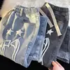 Venta al por mayor transfronteriza estilo Hong Kong marca de moda jeans con estampado de estrellas, primavera/verano finos versátiles holgados rectos casuales pantalones de algodón
