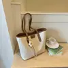 Bolso de mujer con diseño único y gran capacidad, nuevo bolso de hombro de moda de verano para ir al trabajo, popular bolso tote tejido