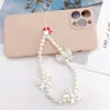 Cordão para celular com laço de pérola em forma de coração para meninas, cordão feito à mão com contas para celular, pingente curto em U para mulheres