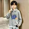 Camiseta Larga Falsa de Dos Piezas para Niños Primavera/Otoño 2026 Estilo Coreano Top de Punto Waffle Atractivo Casual Versátil Capa Base Camiseta de Moda