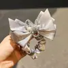Exquisito y de alta gama, estilo coreano, scrunchie de satén con lazo de cristal, diseño de nicho, banda elástica alta para el cabello para mujeres