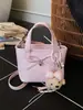 Bolsa de mão de nicho com laço para mulheres, novo modelo 2026, bolsa tipo saco com textura de couro oleado, bolsa transversal moderna para o dia a dia e para o trabalho