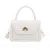 Bolso de mano pequeño cuadrado texturizado popular de este año para mujer, nuevo modelo otoño 2026, bolso de hombro de color liso con patrón de escamas de pez, bolso cruzado de moda