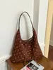 Bolso casual de lunares para mujer 2025 modelo nuevo gran capacidad bolso de hombro para ir al trabajo bolso de axila bolso de mano color liso modelo nuevo