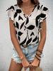 Camisa de mujer color albaricoque de manga corta informal con cuello en V estampado transfronterizo europeo y americano de primavera y verano de 2025