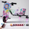 Suministro exclusivo transfronterizo de coche eléctrico inteligente de deriva para niños, kart de deriva de tres ruedas, coche de deriva de un asiento giratorio 360 grados