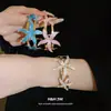 Pulsera Metálica Esmaltada de Estrella de Mar Europea y Americana Transfronteriza Abrible Pulsera Retro Moda con Temperamento Lujo Ligero Sensación de Alta Gama Joyería de Mano para Mujer
