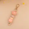 Nuevo colgante de silicona con cuentas hecho a mano, creativo, para manualidades, con diseño de margarita de dibujos animados, colgante para bolso, llavero, accesorios