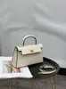 Elegante bolsa Kelly com fivela de prata e padrão manual 2026 nova moda feminina bolsa de mão de segunda geração com fivela dourada, bolsa de ombro e transversal
