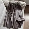 Otoño 2026 Nuevo Estilo Vintage Trendy Falda de Longitud Media de Cuero Proteico, Cintura Elástica que Reduce la Edad, Venta al por Mayor H15CQ6129