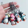 Directo de fábrica llavero creativo de PVC pingüino lindo esquiando colgante para bolsa muñeco de llavero de dibujos animados colgante
