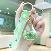 Chaveiro Estrela Preenchido com Óleo e Areia Movediça Desenho Animado, Chaveiro de Boneca Transparente em Acrílico com Areia Movediça, Decoração para Mochila de Estudante